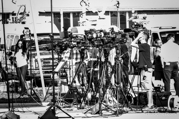 HARVEY IL - AUGUST 20, 2014 Major media outlets wait for a government official to interview during a hostage standoff in Harvey, IL on August 20, 2014 