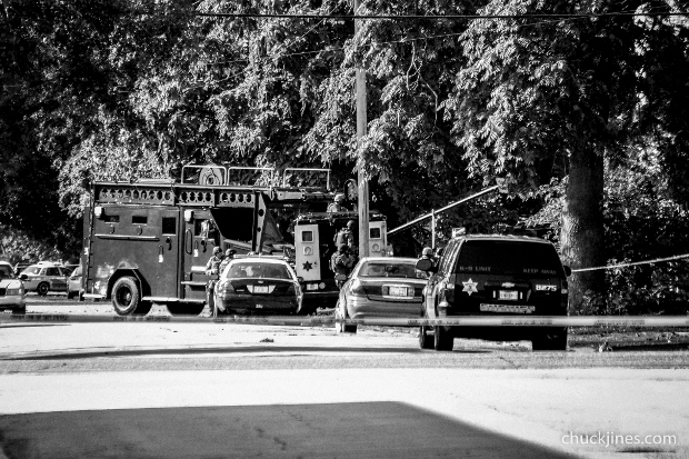 HARVEY IL - AUGUST 20, 2014: SWAT team prepares to enter the house and forcibly end the hostage standoff. 