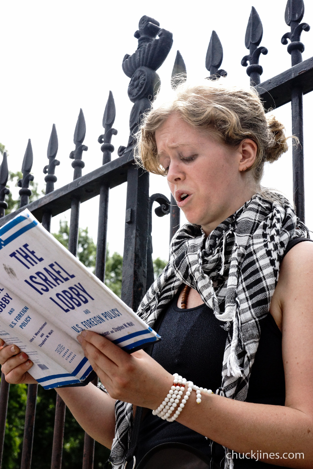 Stacy, from Ohio, reads from the book THE ISRAEL LOBBY AND U.S. FOREIGN POLICY by, John J. Mearsheimer, in Lafayette Square outside the White House. (1 of 1)