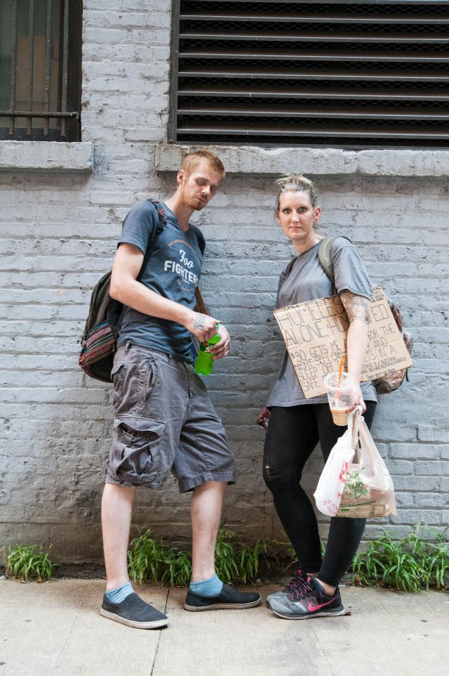 CHICAGO, IL. Sep 6, 2015 - Caleb Higgins, age 26 (left), and Mandrell White, age 34 (right), prepare for their morning routine of panhandling along Chicago's Michigan Ave., in order to raise enough money to feed their heroin habits.