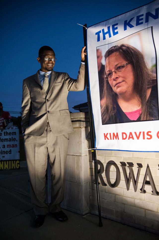 MOREHEAD, Ky. Sep 14, 2015 -North Carolina resident, Samario More, holds a sign outside of the Rowan County Courthouse in support of county clerk Kim Davis' refusal to issue marriage licenses to same-sex couples.