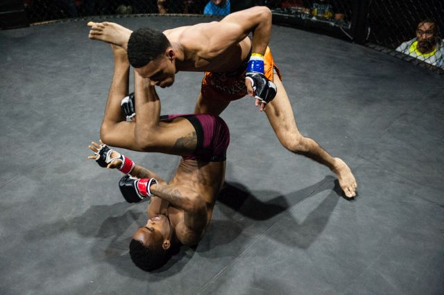 Derrick Wick (Bottom) works his ground defense skills as Eddie Lopez delivers a hailstorm of strikes from above during TFC 135, Friday, September 25, 2015. 