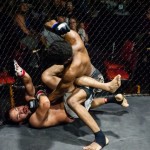 Ronnie Gibbs (Top) pounds his opponent, Angel Carrillo, during TFC 135, Friday September 25, 2015.