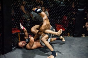Ronnie Gibbs (Top) pounds his opponent, Angel Carrillo, during TFC 135, Friday September 25, 2015.