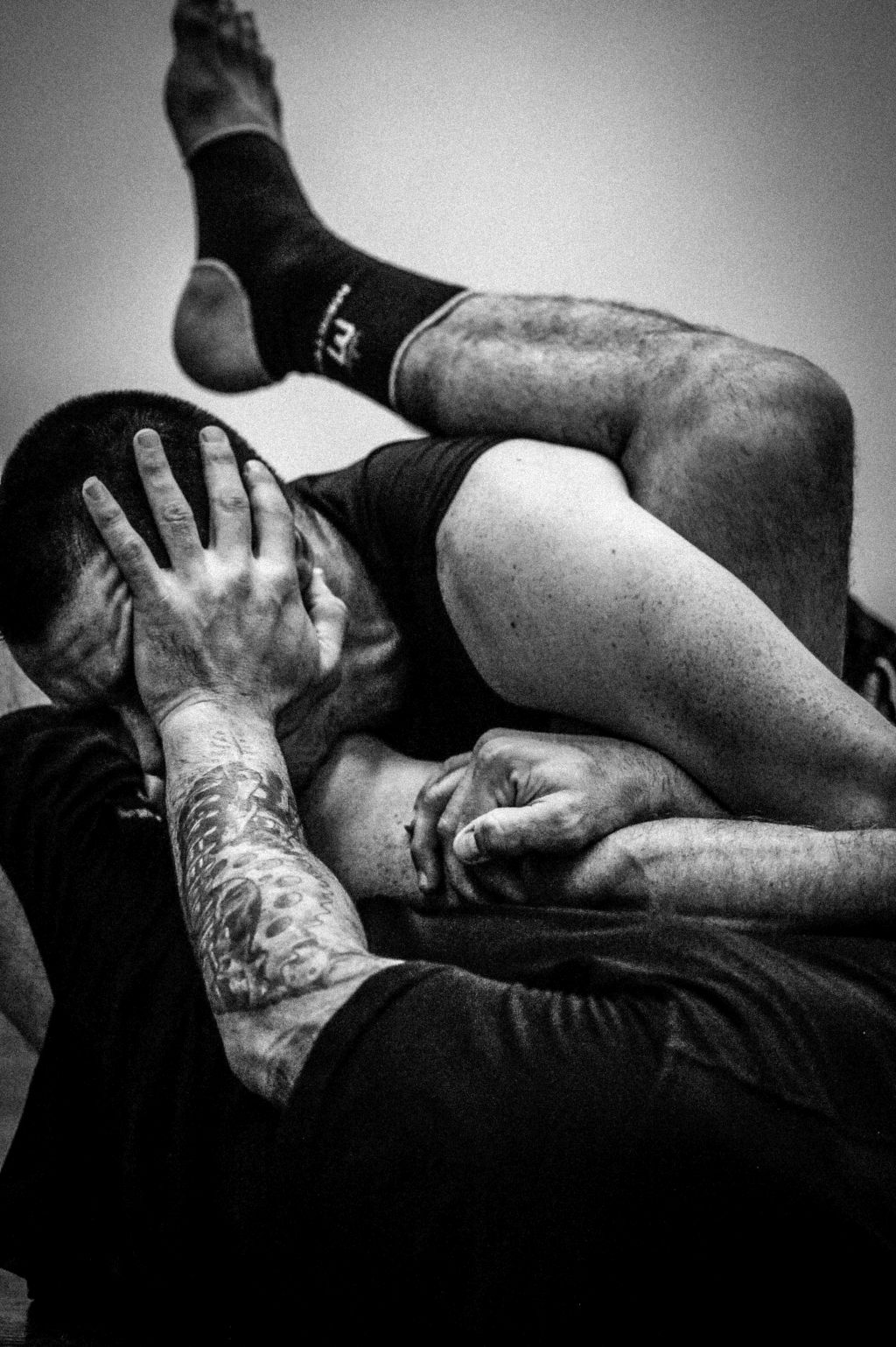 Angelo Amato (ground) and Tyler Lorek work on their grappling skills at the UFC Gym in Orland Park Il. on October 10, 2015