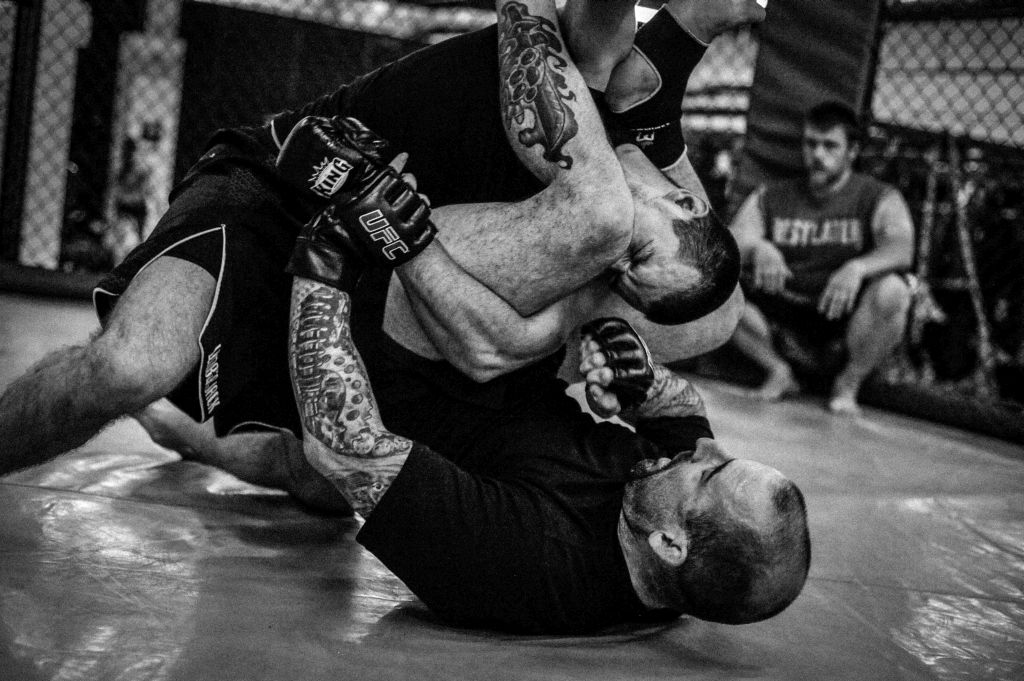 Angelo Amato (ground) puts the pressure on Tyler Lorek as they work on their grappling skills in preparation for Tyler's first title fight. 