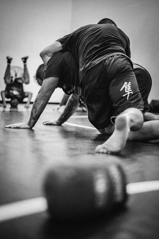 Tyler Lorek (top) works on his grappling skills with Joey Karczewski in preparation for his first title fight in November