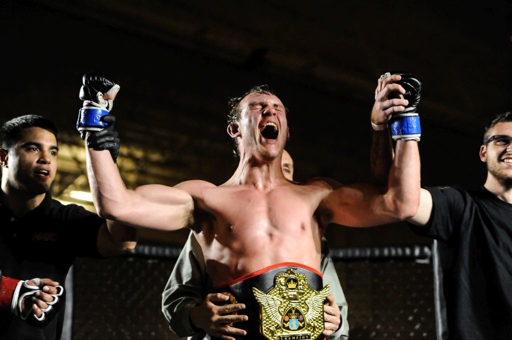 The Thrill of Victory More Mma - After a long fought battle, Dan Regal rejoices in winning the 185 lb. championship belt.