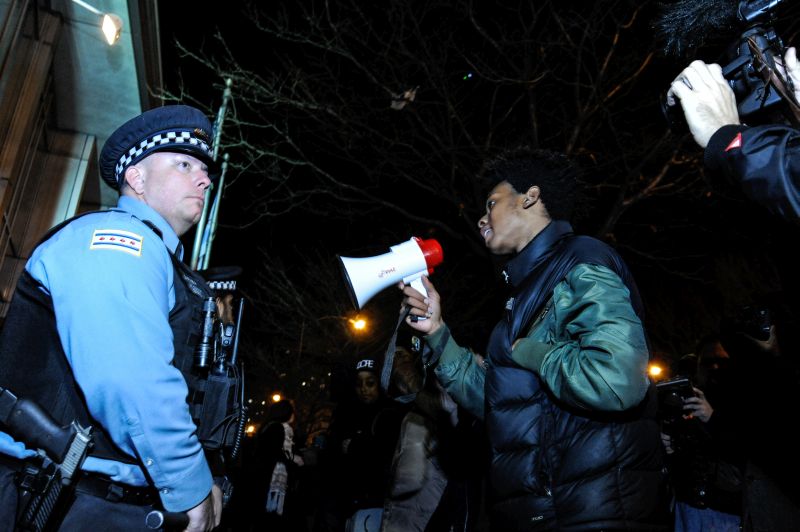 Chicago protesters march as police release video of officer shooting teen